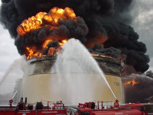 Storage tank fire illustrating the tank-farm escalation problem.